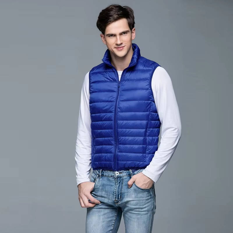 Men's navy lightweight packable down vest, slim-fit travel layer with zippered chest pocket