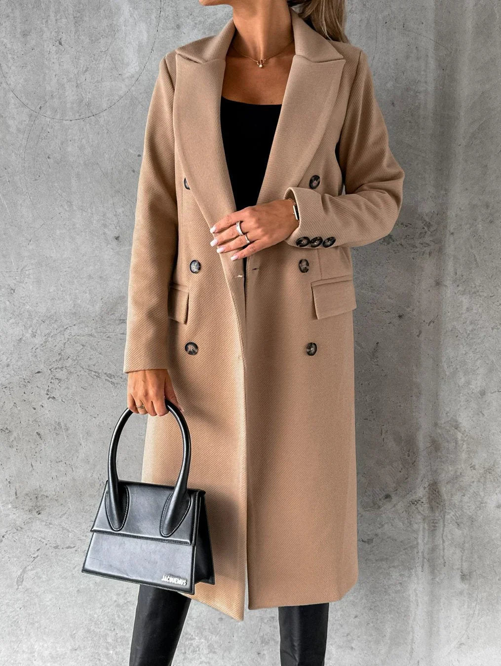 Charcoal double-breasted long coat notched collar front flap pockets tailored professional silhouette