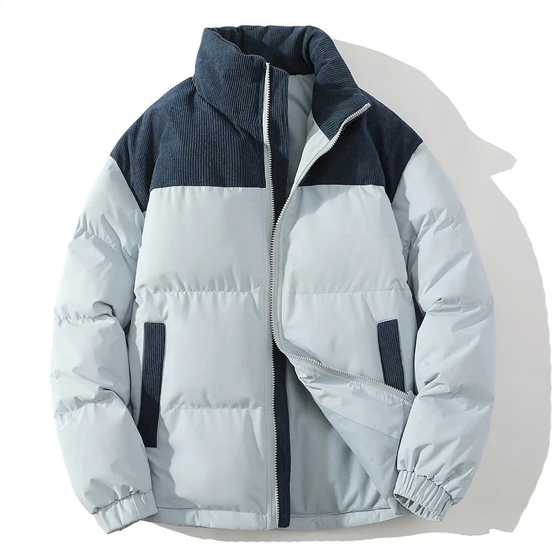 Men's hip-length premium puffer jacket with quilted insulation and textured corduroy yoke panel