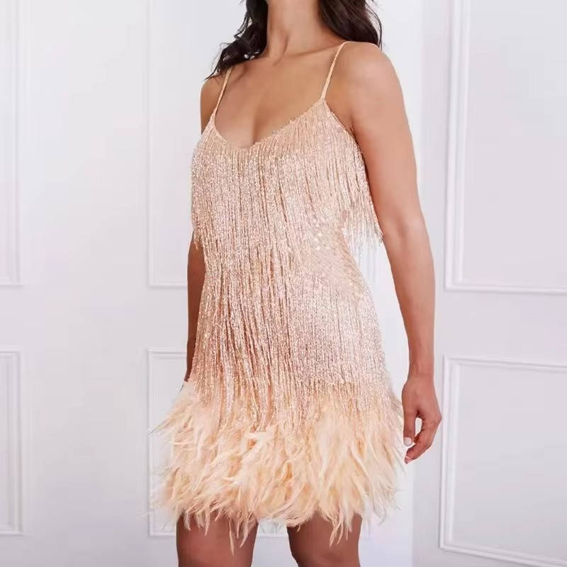 White sleeveless mini cocktail dress with fringe detail and feather hem, body-conscious fit