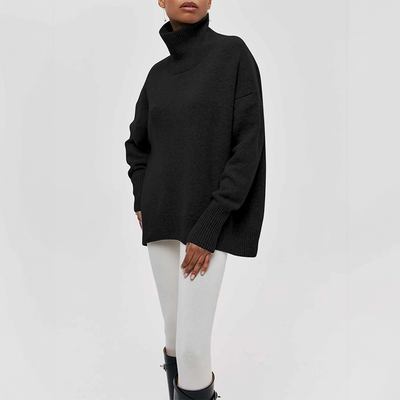 Women's oversized turtleneck knit sweater with draped silhouette and ribbed cuffs for effortless layering