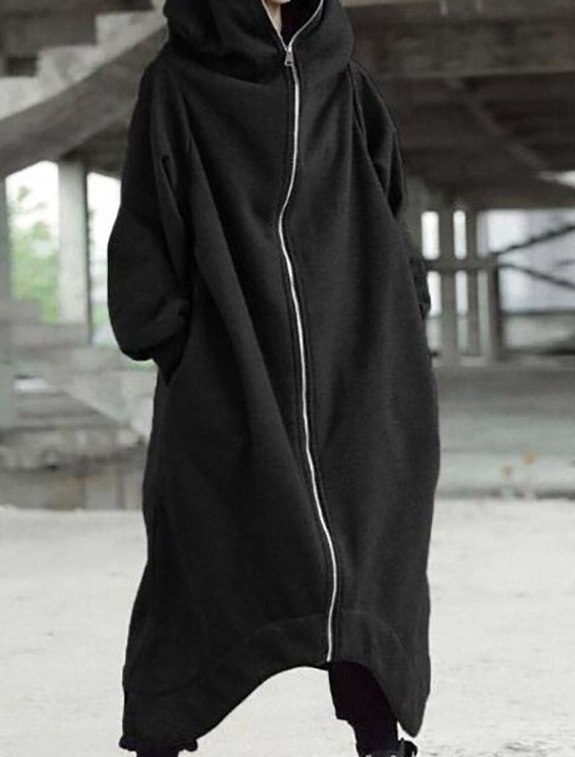 Women's calf-length hooded long coat in neutral tone, elegant urban winter silhouette with refined fit