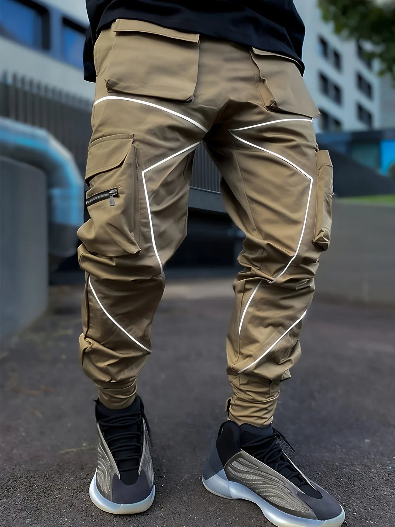 Black tapered cargo jogger with reflective high-visibility piping and featherweight fabric for night running