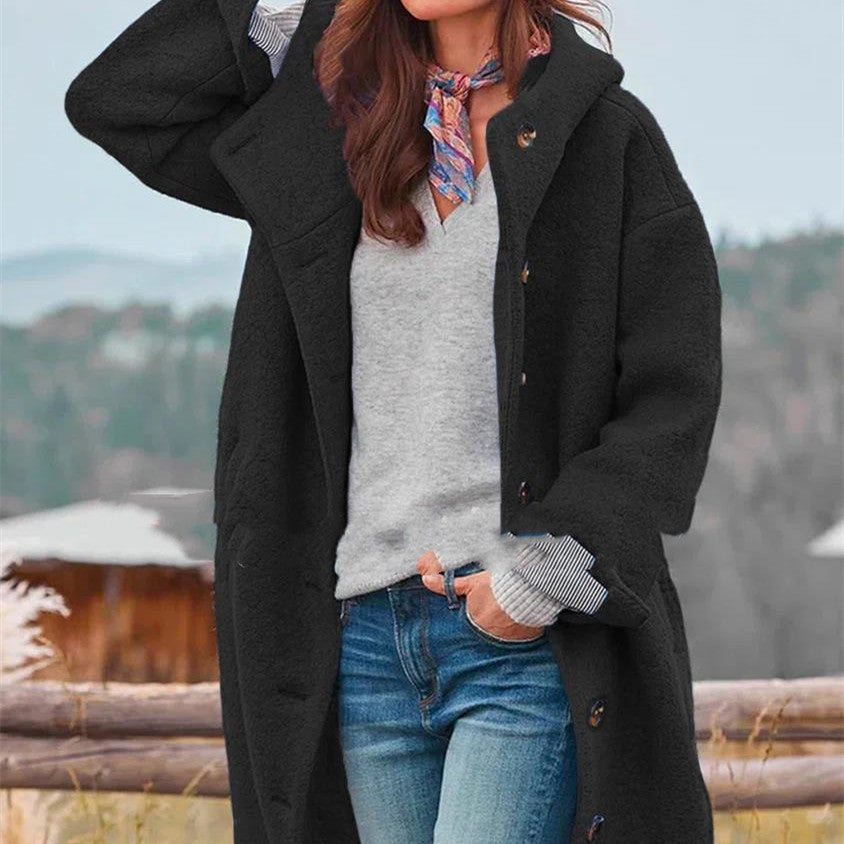 Women's oversized wool coat in bold blue with loose silhouette and front button closure