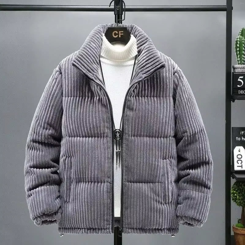 Unisex navy corduroy puffer jacket with quilted warmth and classic ribbed texture for cool weather