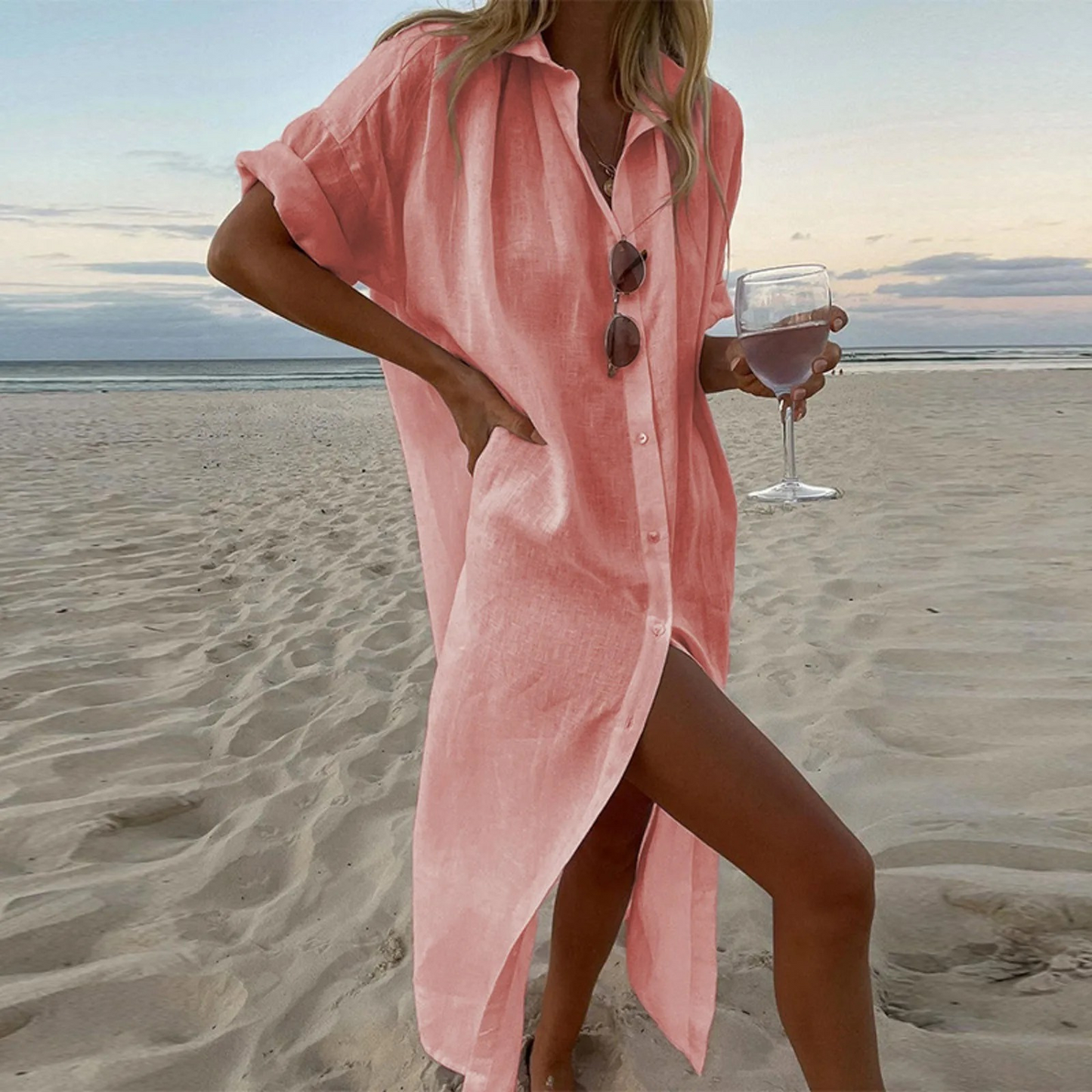 Elegant white shirt dress with high slits and front button details for a refined modern silhouette