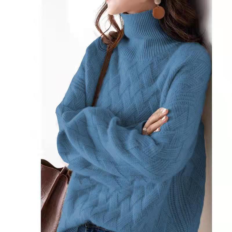 Women's cream cashmere turtleneck sweater with cable-knit texture and relaxed fit for cozy warmth
