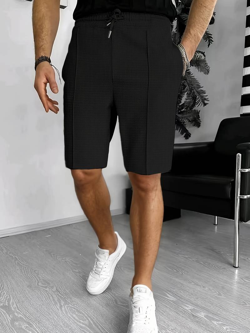 Men's waffle knit drawstring shorts with textured surface and dual pockets for casual comfort