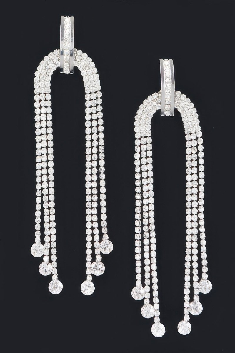Long rhinestone fringe dangle earrings with polished metal finish and shimmering drop for evening wear