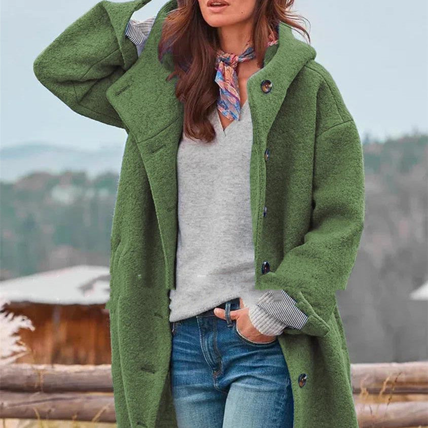 Women's oversized blue wool coat with statement buttons, cozy loose fit for stylish winter warmth