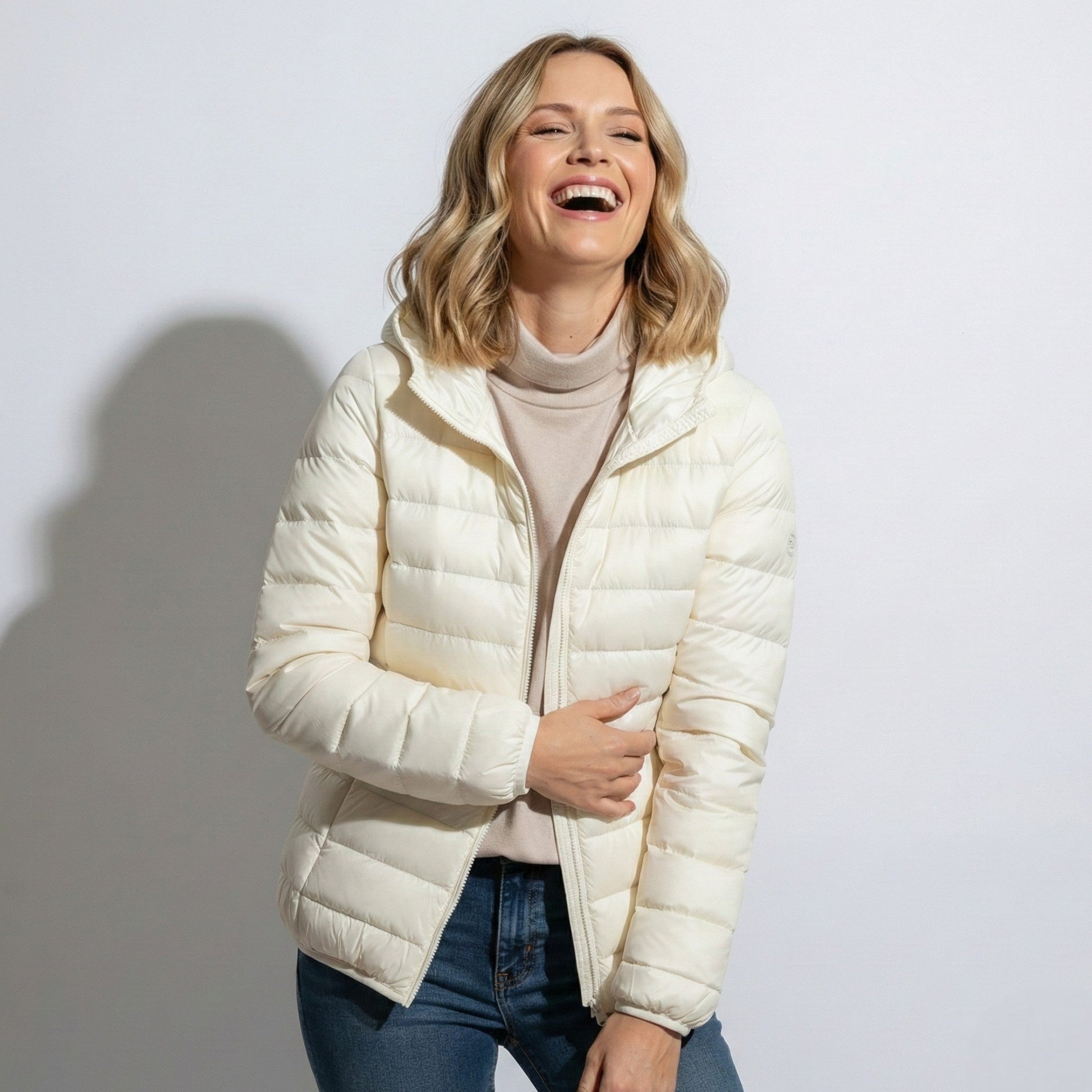 Women's lightweight hooded puffer jacket sleek silhouette packable design for cold-weather commutes