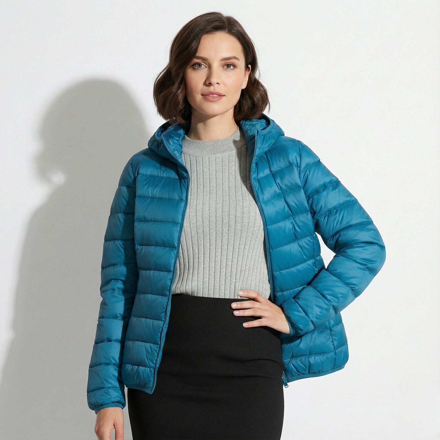 Women's lightweight hooded puffer jacket sleek silhouette packable design for cold-weather comfort