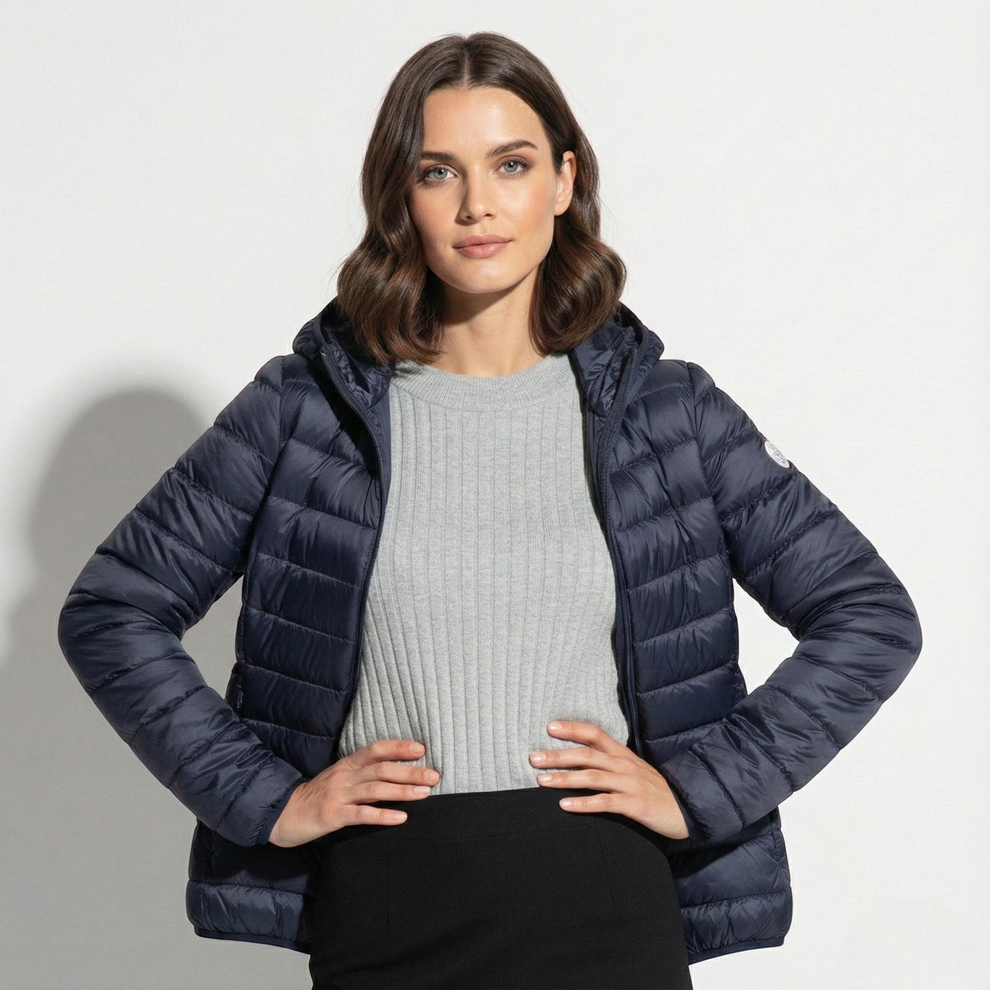 Women's lightweight hooded puffer jacket sleek silhouette packable design for cold-weather commutes