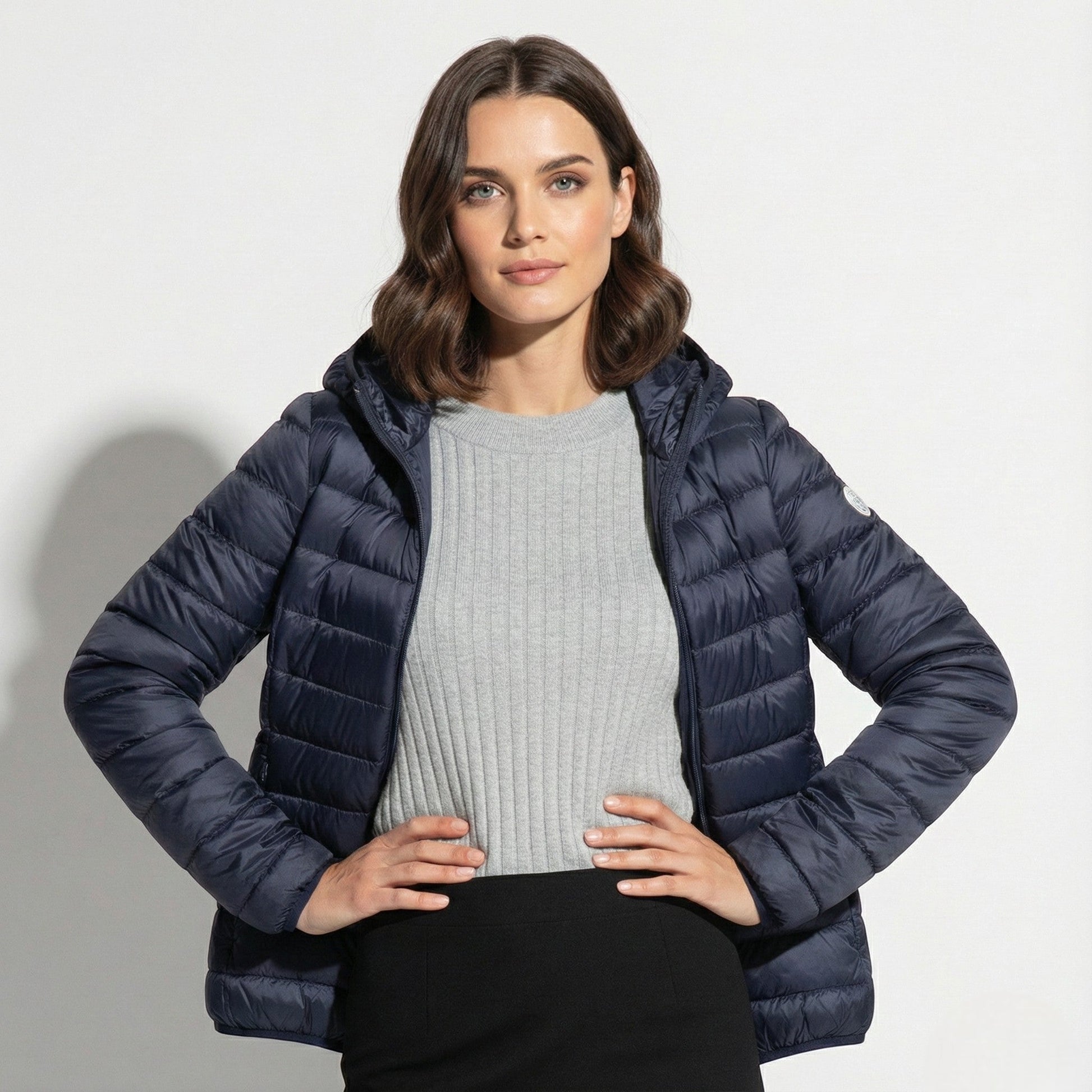 Women's lightweight hooded puffer jacket sleek silhouette packable design for cold-weather commutes