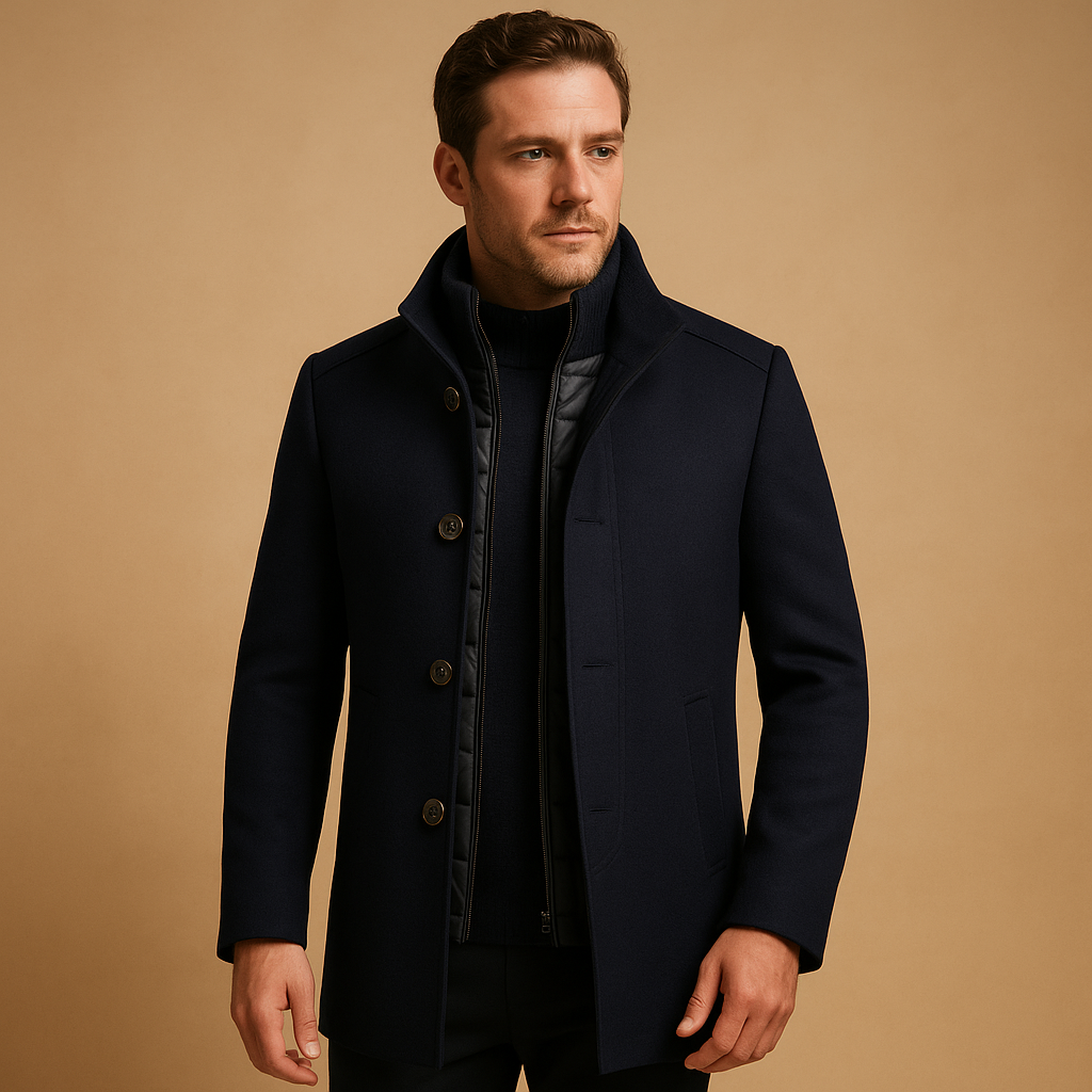 Charcoal unisex winter overcoat with sharp structured tailoring, insulated lining, and timeless elegant silhouette