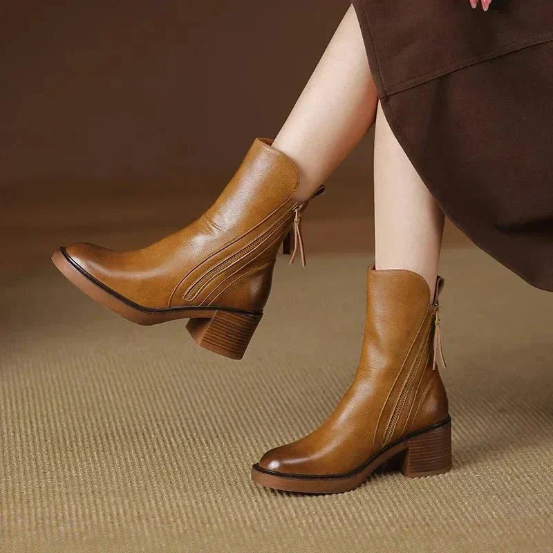 Women's black winter ankle boots with side zipper and sleek block heel for city wear