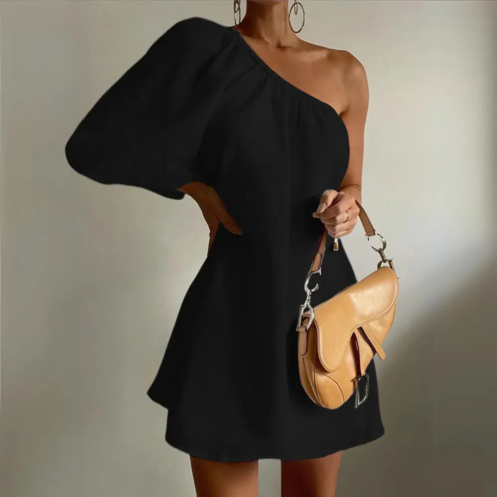 White slim-fit mini dress with one-shoulder puff sleeve, chic modern party style for women