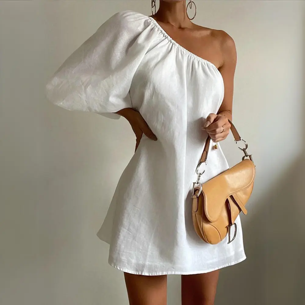 White slim fit one-shoulder puff sleeve mini dress with chic contemporary silhouette for parties