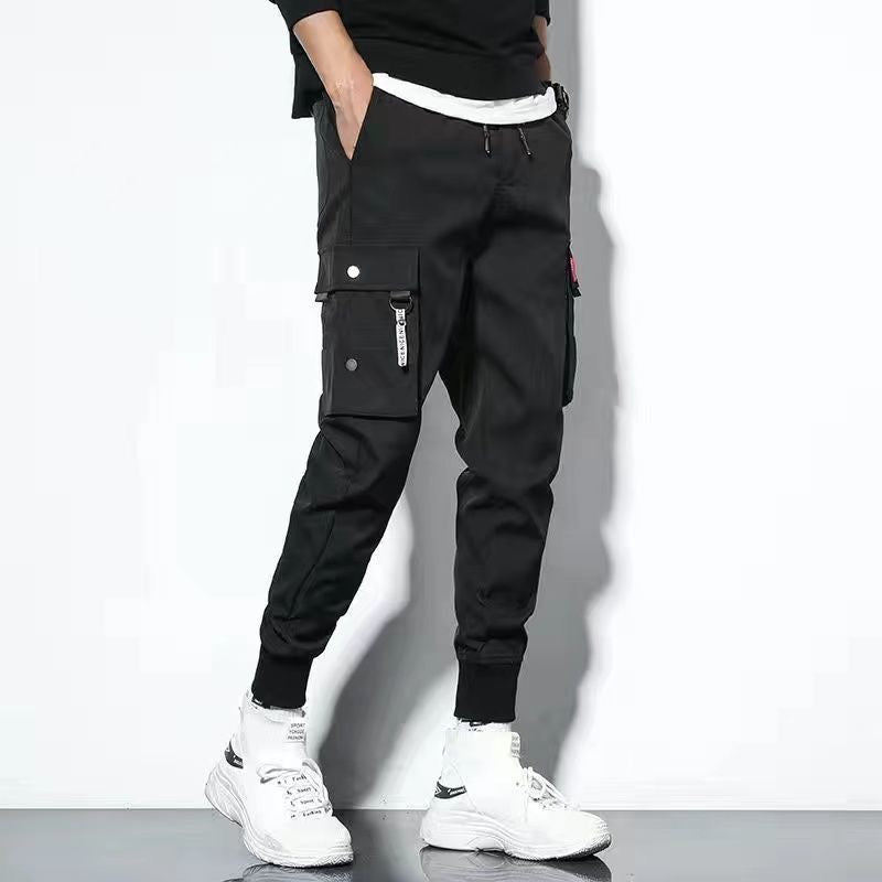 Men's oversized cargo pants relaxed fit solid color with multiple large flap pockets for outdoor wear
