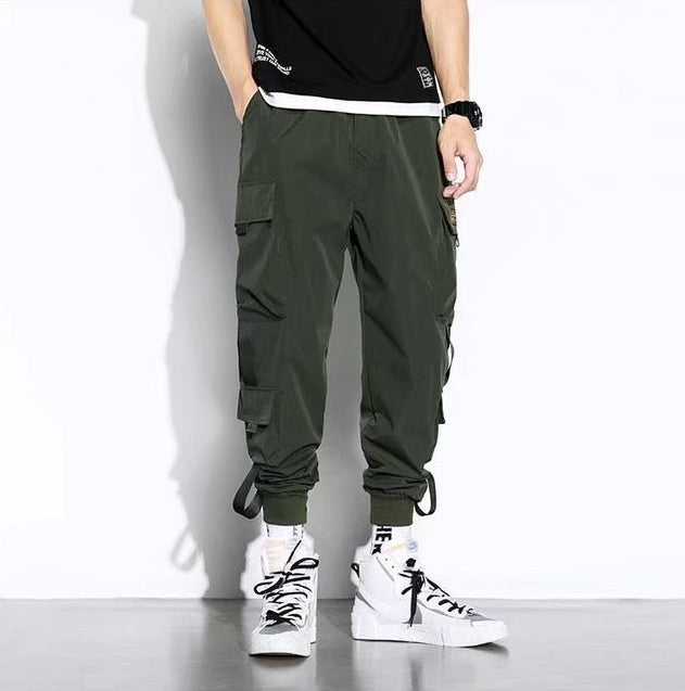 Men's oversized cargo pants relaxed fit solid color with multiple large flap pockets for outdoor wear