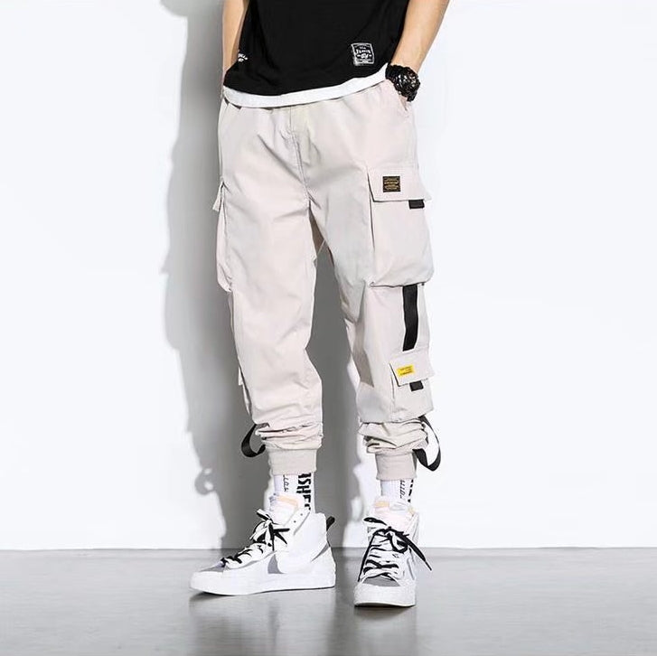 Men's oversized cargo pants relaxed fit solid color with large flap pockets for outdoor casual wear