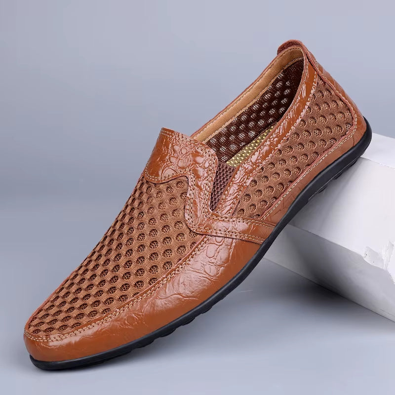 Men's black mesh loafer with perforated upper, faux leather trim, and cushioned slip-on design