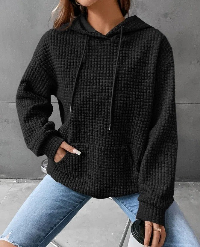Women's loose-fit hoodie in soft textured fabric with kangaroo pocket for casual everyday comfort