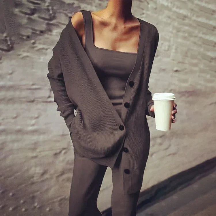 Women's oversized longline rib knit cardigan with button closure and side pockets, versatile all-season layering