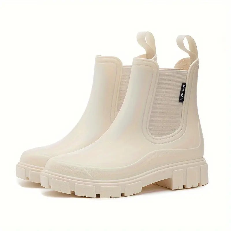 Women's black waterproof Chelsea boots slip-on style with elastic side panels for all-day comfort