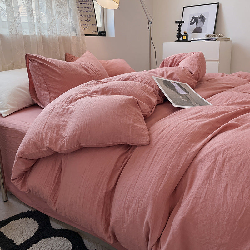 Washed cotton bedding set in soft neutral tones, minimalist style with pre-softened lived-in texture