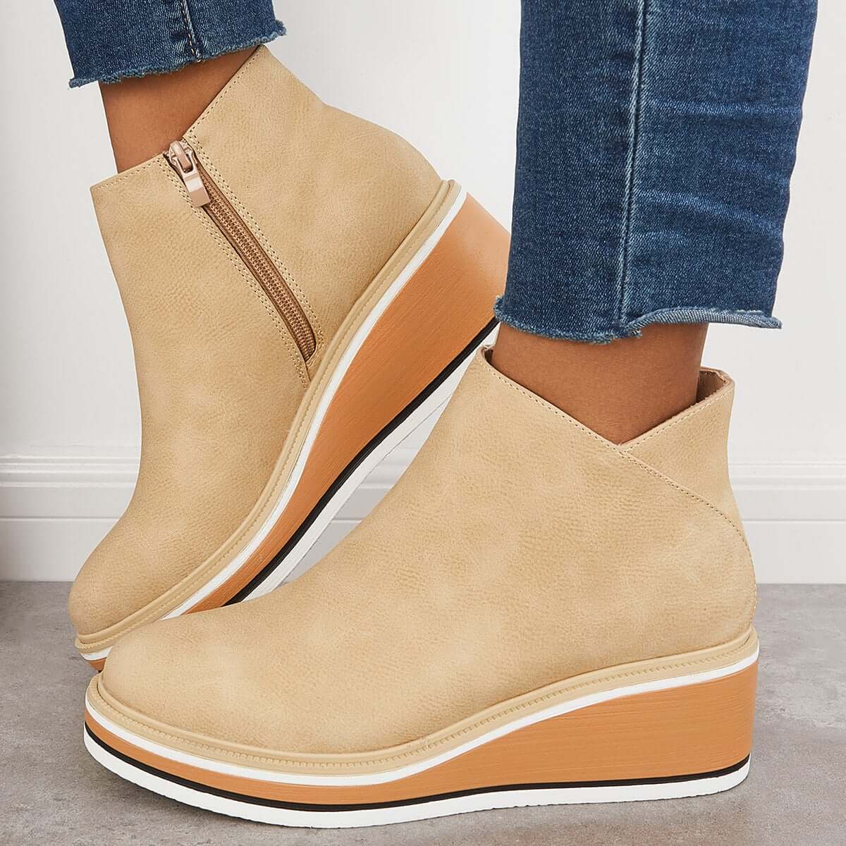 Women's black platform ankle boots with side zipper, elegant contemporary style for height and stability
