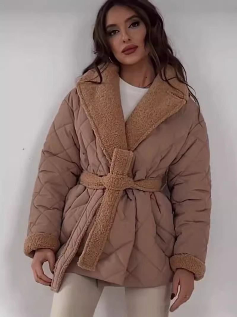 Women's down jacket with lapel collar, tie belt, lightweight warmth, flattering silhouette in teddy-look finish