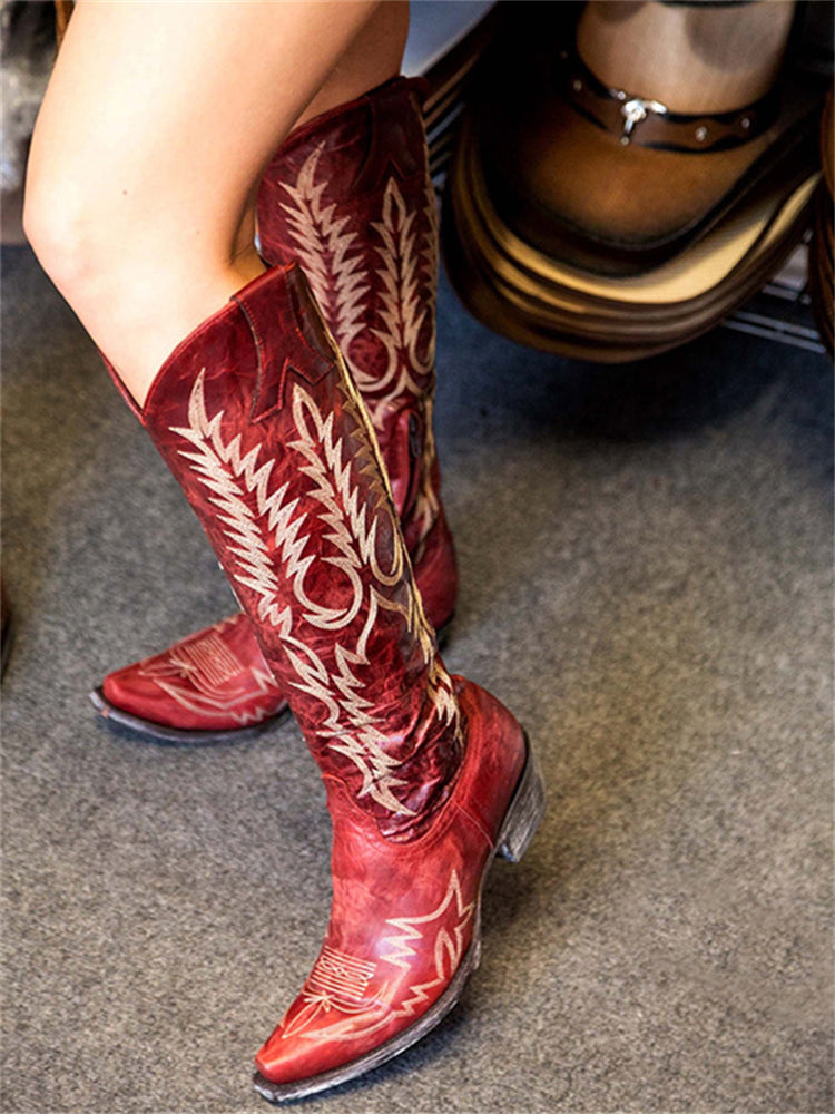 Women's brown knee-high western cowboy boots with vintage floral embroidery and low heel rubber sole