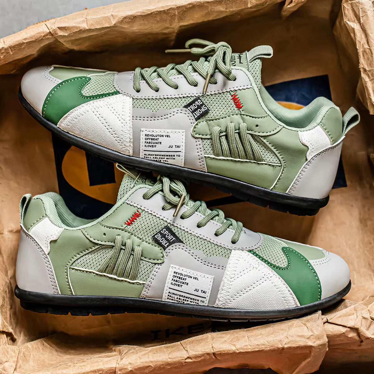 Bold multi-panel trainer sneakers in contrast colorways with reinforced stitching for streetwear style