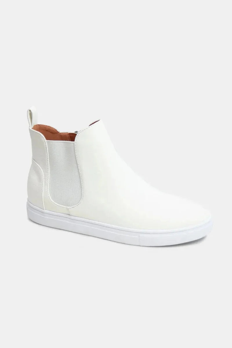 Unisex mid-top faux suede sneakers in neutral tones with elastic side panels for easy slip-on wear