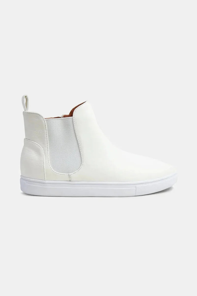 Unisex mid-top faux suede sneakers in neutral tones with elastic side panels for slip-on comfort