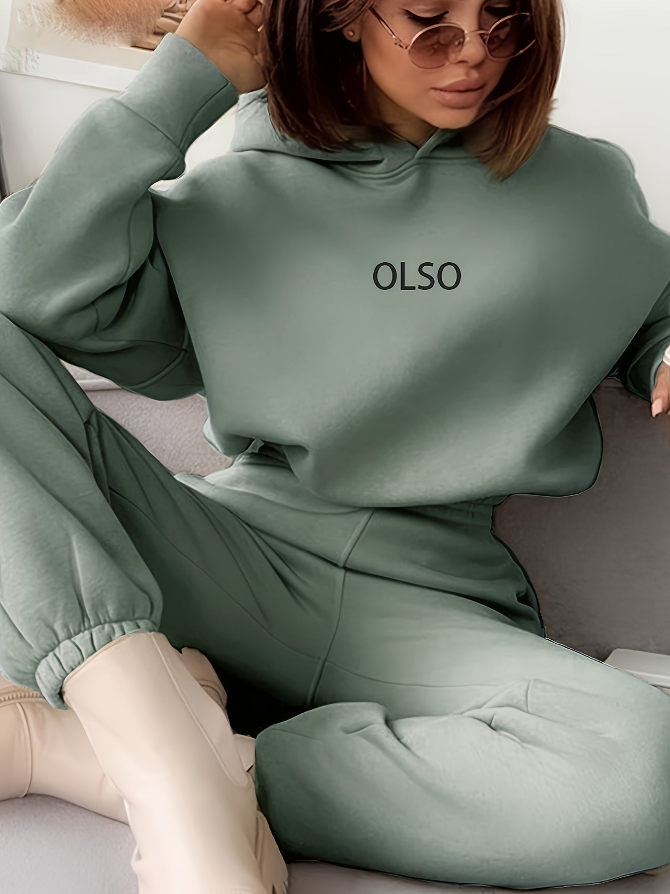 Women's sustainable two-piece hoodie and sweatpants tracksuit set in coordinated casual lounge style