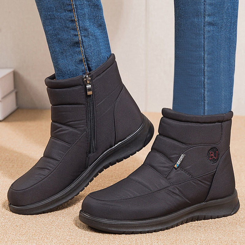 Women's black waterproof insulated winter boots urban style ankle silhouette with cushioned sole