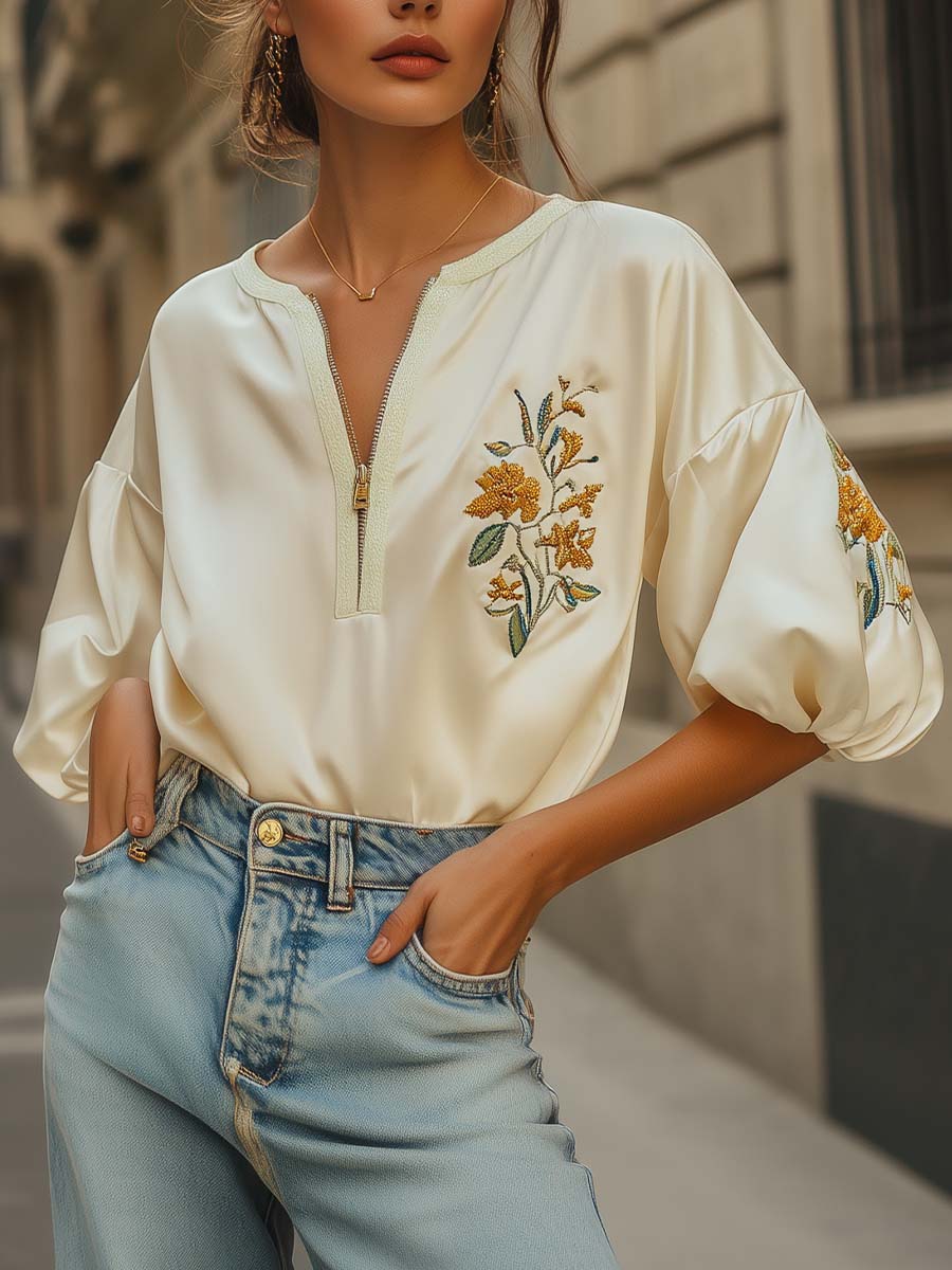 Women's white cotton blouse with zipper closure and subtle embroidery, elegant chic style