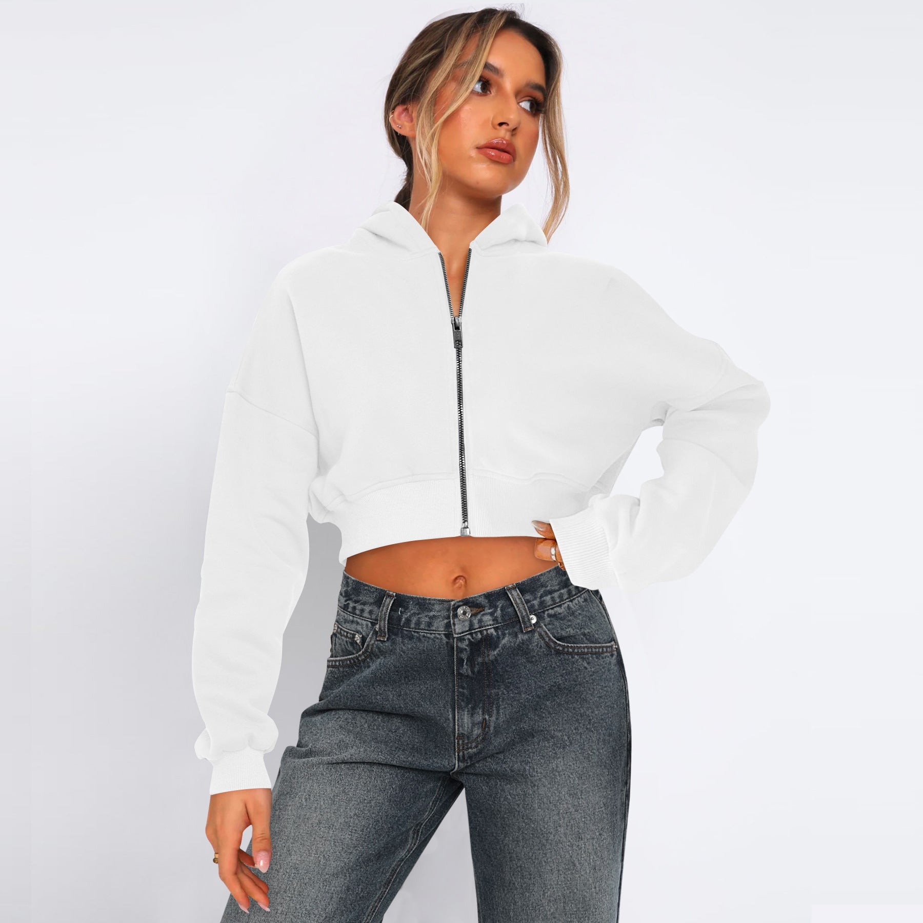 Women's cropped fleece zip hoodie in soft fabric, streetwear-inspired silhouette with waist-defining cut
