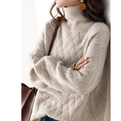 Women's cream cashmere turtleneck sweater with cable-knit texture and luxurious relaxed fit