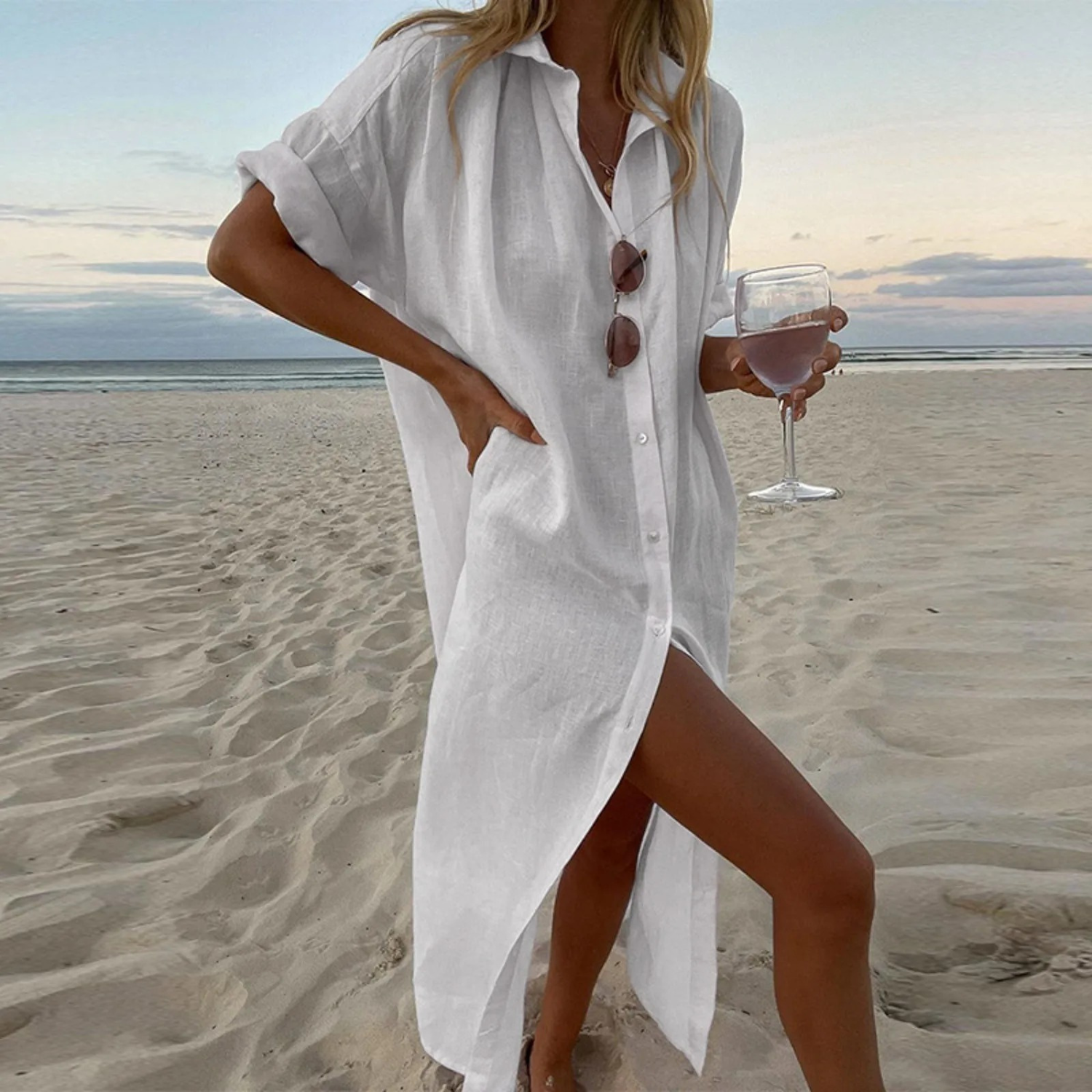 Elegant white shirt dress with high slits and front button details for a refined modern silhouette