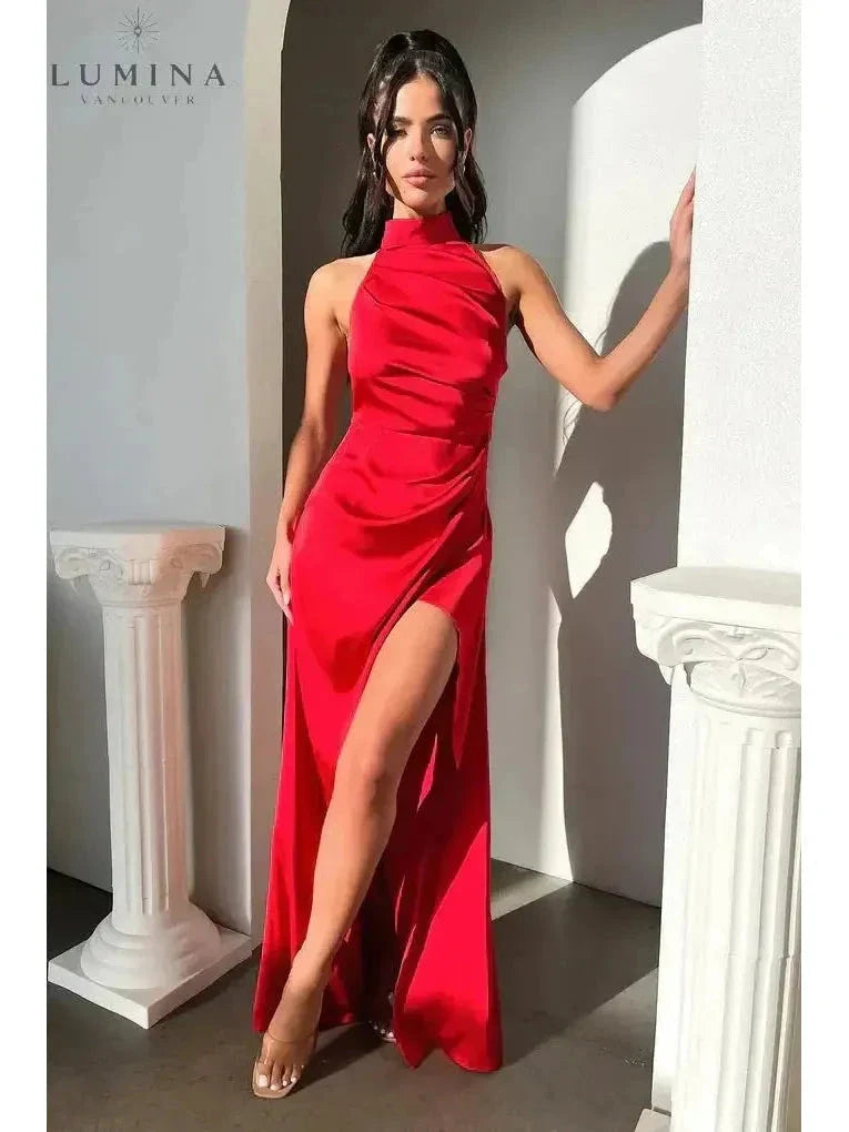 Elegant halterneck sleeveless maxi dress with daring side slit, glamorous evening statement piece