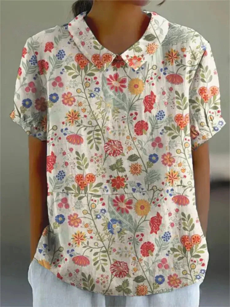 Women's white collared short sleeve blouse relaxed fit gathered sleeves curved hem office-ready