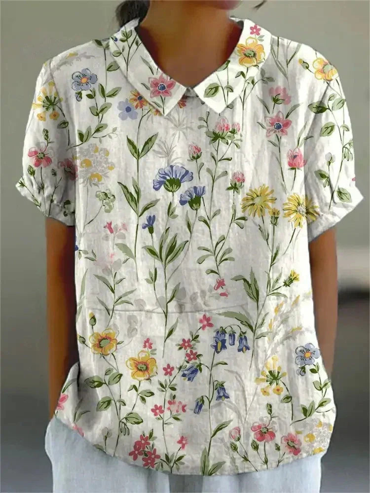 Women's white collared short sleeve blouse relaxed fit gathered sleeves curved hem office ready