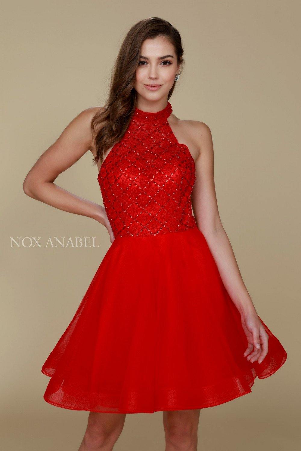 Short beaded illusion bodice halter prom dress with open back and flirty tulle skirt