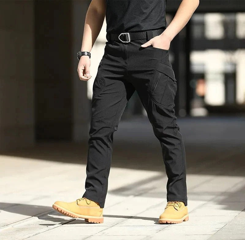Men's olive green adventure hiking pants structured fit durable multifiber fabric outdoor performance