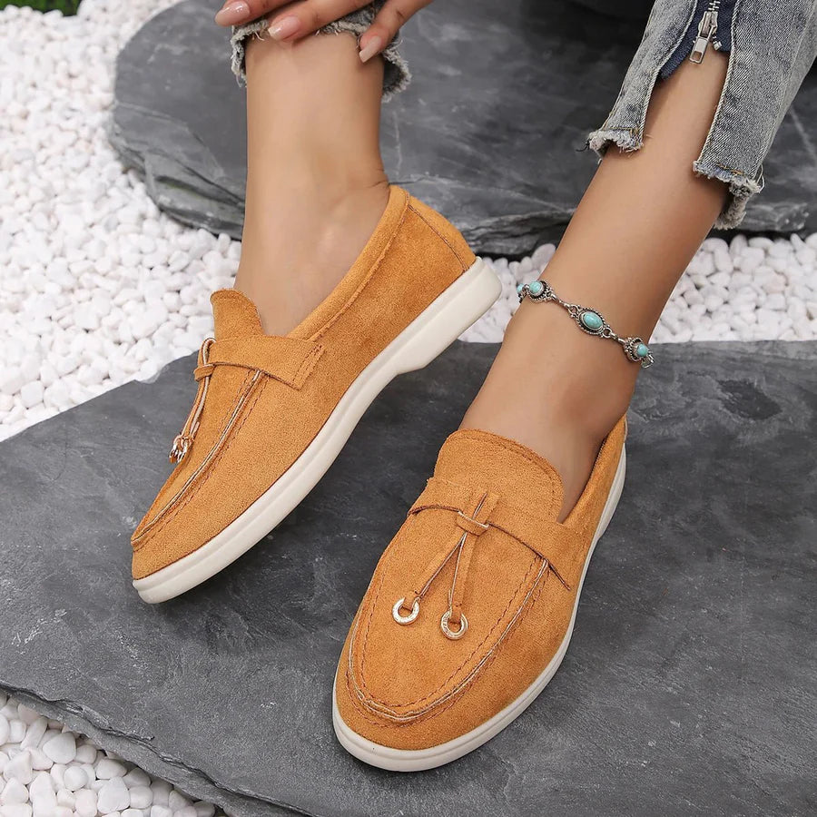 Women's classic slip-on PU leather loafers with moccasin styling and low sole for effortless wear