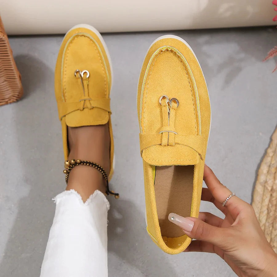 Women's classic slip-on loafers in sleek PU leather with moccasin styling and low sole