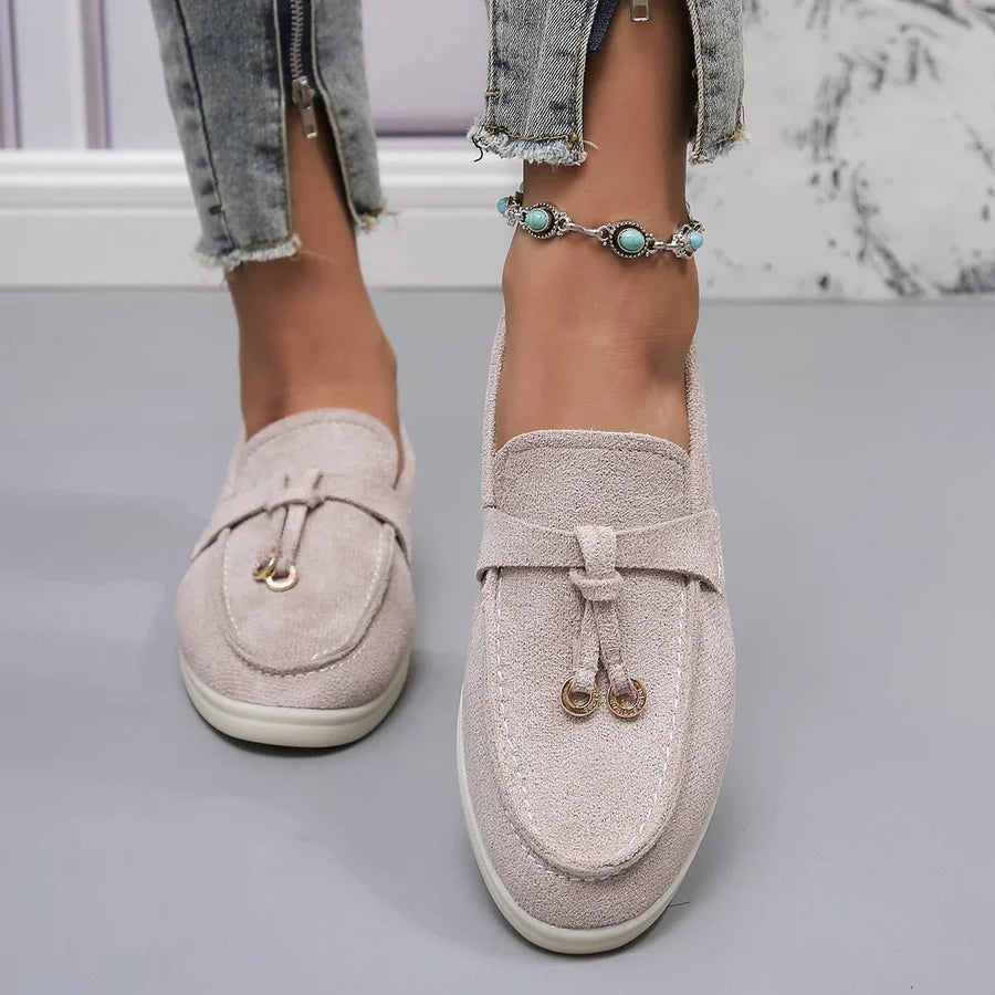 Women's classic slip-on loafers in sleek PU leather with moccasin styling and low sole